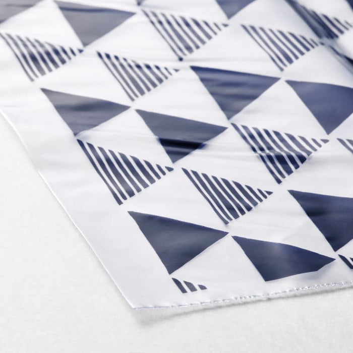 Close-up of blue geometric triangle and stripe pattern on IKEA ISTAD resealable bag surface