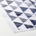 Close-up of blue geometric triangle and stripe pattern on IKEA ISTAD resealable bag surface