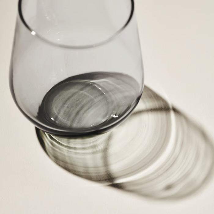  Top-down view of IKEA IVRIG clear glass showing smooth curved surface and light reflection