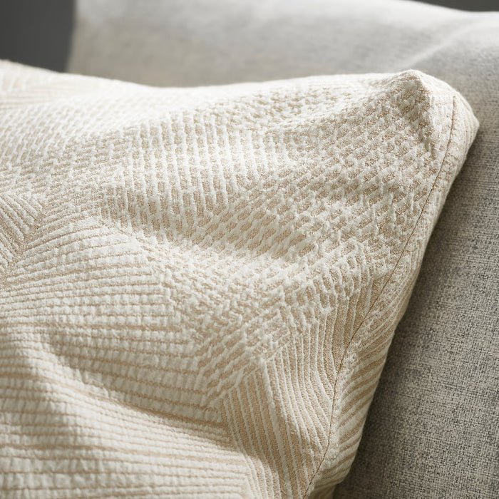 Close-up of IKEA JÄTTEGRAN jacquard-woven leaf pattern detailing on cushion cover