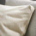 Close-up of IKEA JÄTTEGRAN jacquard-woven leaf pattern detailing on cushion cover