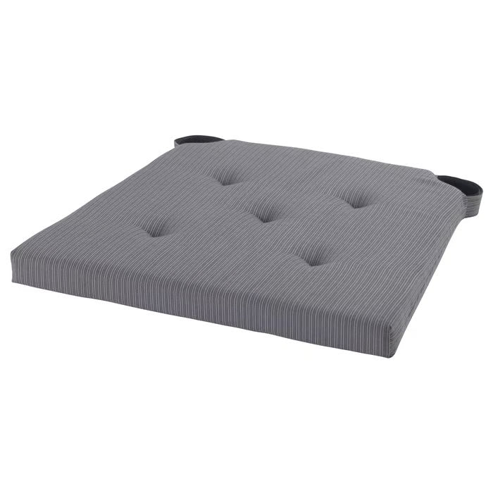 IKEA JUSTINA grey chair pad with tufted cotton fabric and foam filling on white background #10175004