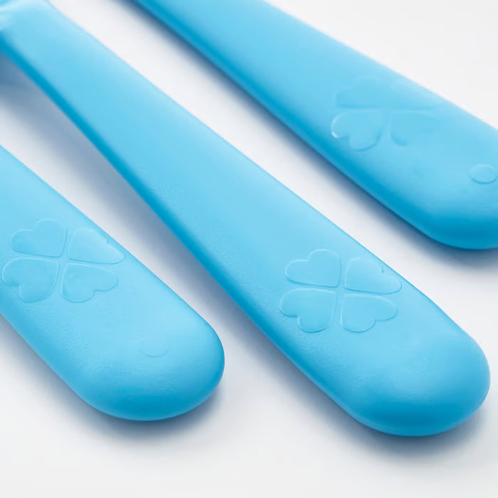 Close-up of IKEA KALAS mixed colour plastic cutlery set showing fork tines and spoon bowl detail