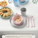 IKEA KALAS colourful kids tableware bowl cup and cutlery set on table with food and personalised napkin