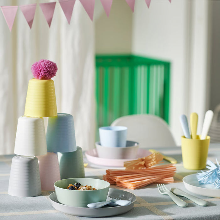 IKEA KALAS kids tableware set with cups bowls spoons and napkins styled on a table