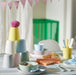 IKEA KALAS kids tableware set with cups bowls spoons and napkins styled on a table