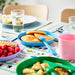 IKEA KALAS colourful kids plates in mixed seasonal colours arranged on a table children's mealtime setting