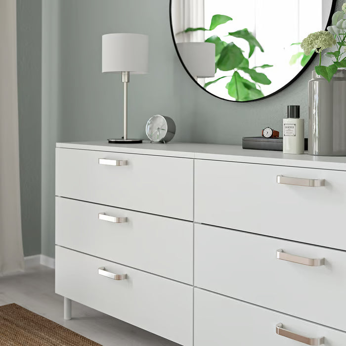IKEA KALERUM handle in stainless steel colour installed on white dresser six-drawer bedroom setting