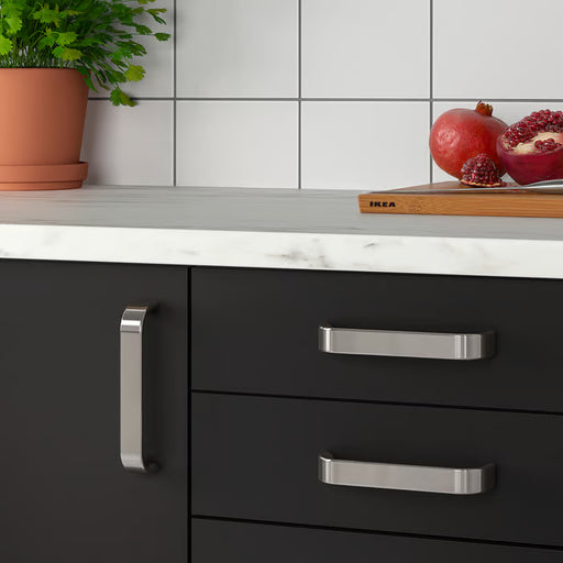 IKEA KALERUM stainless steel handle fitted on modern kitchen cabinet door easy-grip view