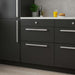 IKEA KALERUM handle installed on dark kitchen cabinets modern interior