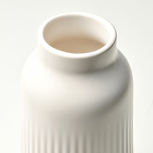 Close-up of IKEA KAPKASTANJ off-white vase showing vertical grooves matte finish and cylindrical shape