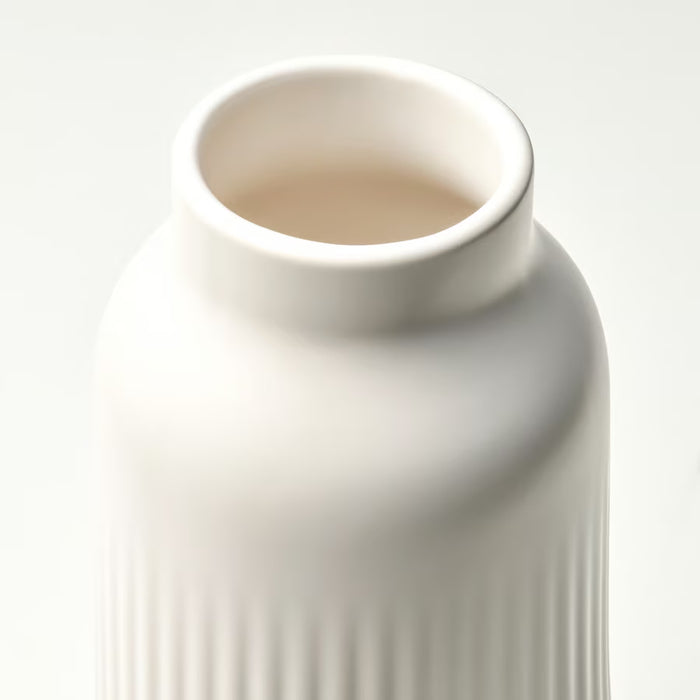 Close-up of IKEA KAPKASTANJ off-white vase showing vertical grooves matte finish and cylindrical shape