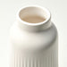 Close-up of IKEA KAPKASTANJ off-white vase showing vertical grooves matte finish and cylindrical shape