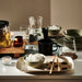 IKEA KARAFF glass carafe on a table setting with tea cups and bowls styled for a home breakfast spread