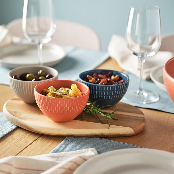 Close-up of IKEA KEJSERLIG stoneware bowl showing pigmented glaze texture and mixed colour finish