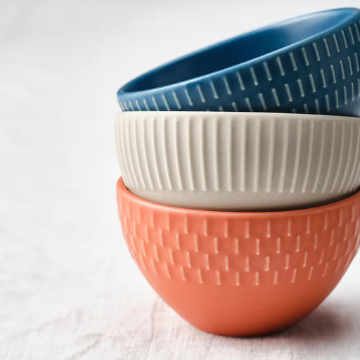 IKEA KEJSERLIG mixed colour bowls arranged on a dining table with food styling