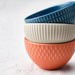 IKEA KEJSERLIG mixed colour bowls arranged on a dining table with food styling