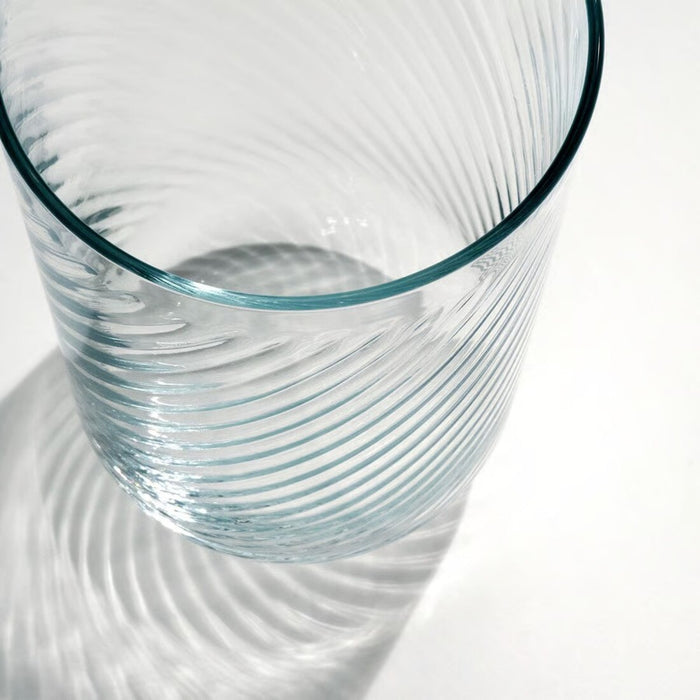Clear glass with wavy design on a white background