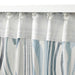 Digital Shoppy Chic white and blue IKEA KLIPPNEJLIKA curtains framing a window with natural light  00568808