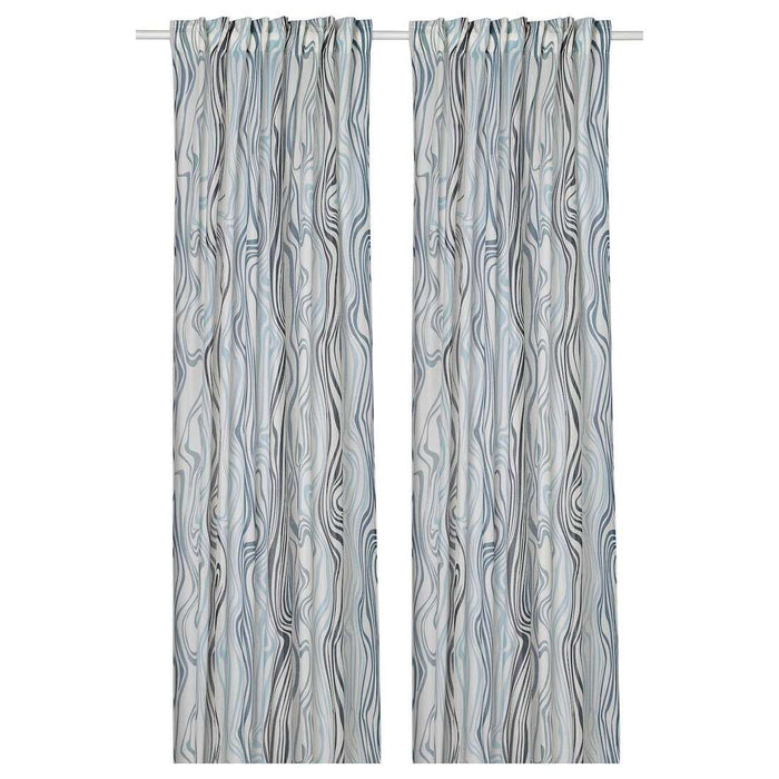 Digital Shoppy Elegant IKEA KLIPPNEJLIKA curtains in white and blue, adding style to a bedroom. 00568808