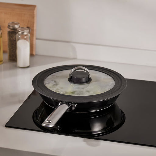 IKEA KLOCKREN glass lid on pot while cooking on stove, steam vent visible
