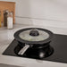 IKEA KLOCKREN glass lid on pot while cooking on stove, steam vent visible