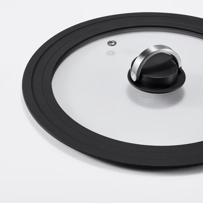 Close-up of IKEA KLOCKREN glass lid steam vent and stainless steel handle detail