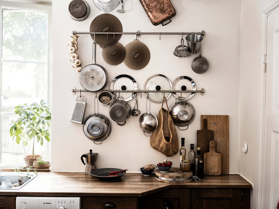  IKEA KLOCKREN pan lids styled in kitchen with wooden countertop pots and plants