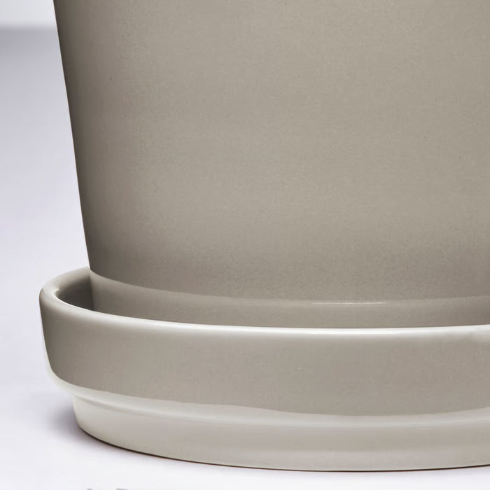 Close-up of IKEA KLOTLÖNN light grey glazed stoneware planter and saucer finish