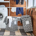  Laundry room setup with multiple IKEA KNALLA bags one filled with clothes near washing machine and drying rack