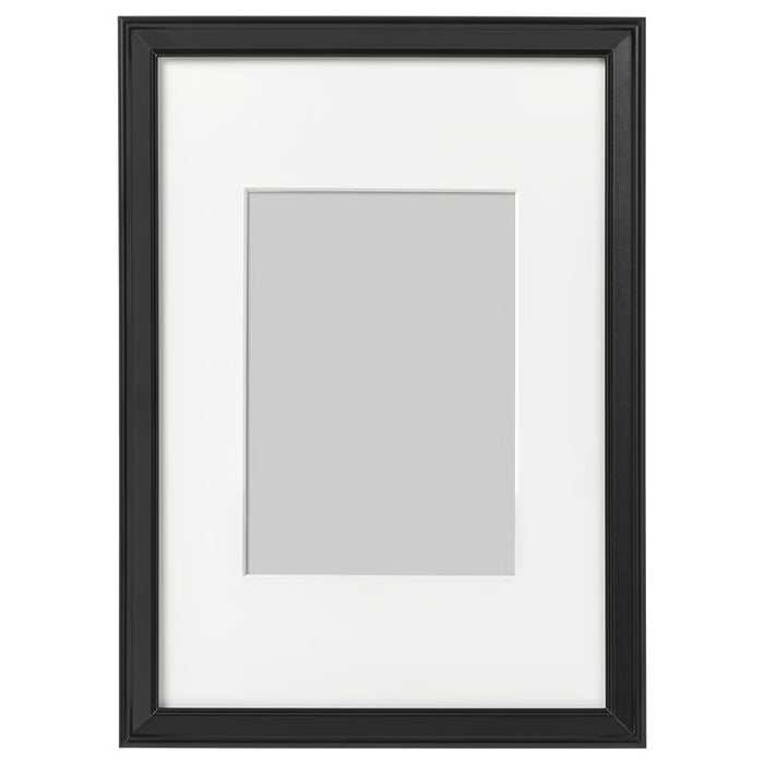 IKEA KNOPPÄNG black photo frame 21x30 cm with white mount on plain background #70387121