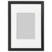 IKEA KNOPPÄNG black photo frame 21x30 cm with white mount on plain background #70387121