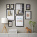 IKEA KNOPPÄNG black frames as part of a full gallery wall with mixed artworks books and decorative objects