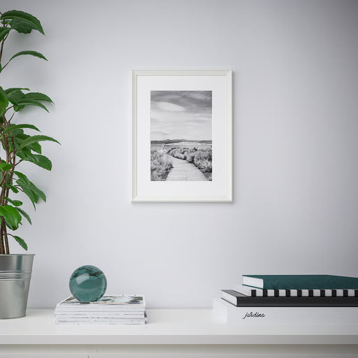 IKEA KNOPPÄNG white frame styled in minimalist room with plant books and magazines on shelf