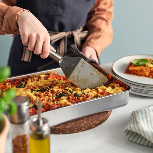 IKEA KONCIS dark grey turner flipping food in a pan during cooking