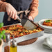 IKEA KONCIS dark grey turner flipping food in a pan during cooking