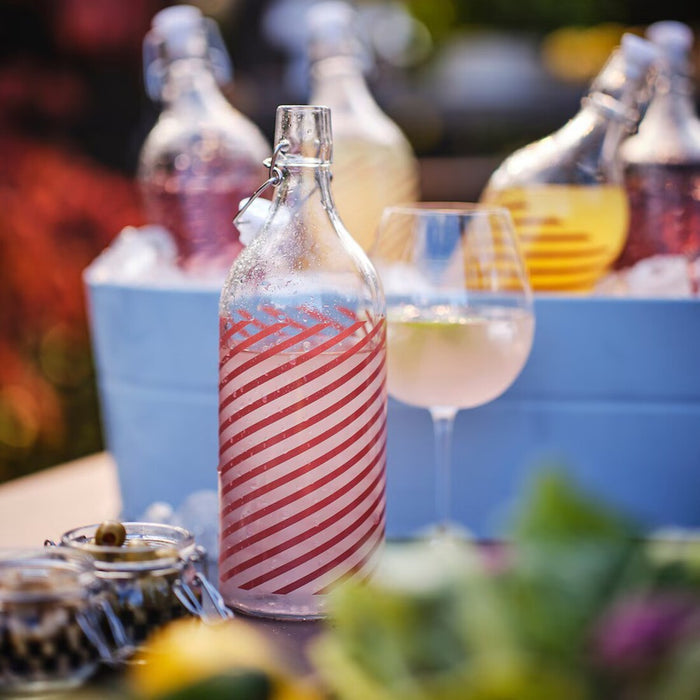 Digital Shoppy Side View of KORKEN 34oz Glass Bottle with Stopper, Grey-Pink Striped Design 90564702