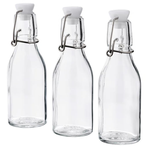 IKEA KORKEN clear glass bottles with white stoppers and metal clips set of 3 front view #30476336