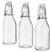 IKEA KORKEN clear glass bottles with white stoppers and metal clips set of 3 front view #30476336
