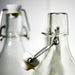  IKEA KORKEN glass bottle with airtight stopper close-up showing clamp and rubber seal detail