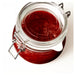 Close-up of IKEA KORKEN glass jar filled with red jam, metal clasp sealed airtight