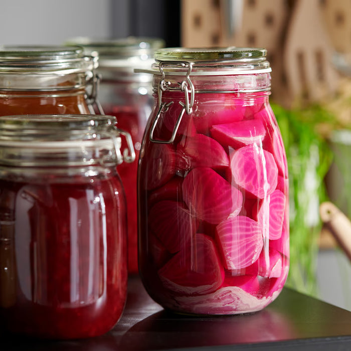  IKEA KORKEN glass jar with lid filled with dry pasta on kitchen countertop