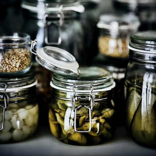  IKEA KORKEN glass jars with metal clip lids storing pickles and seeds, sealed for freshness