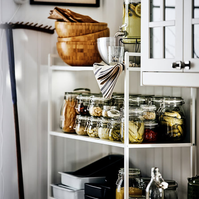IKEA KORKEN jars storing pickles and jams on kitchen shelves one used as beverage glass