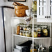 IKEA KORKEN jars storing pickles and jams on kitchen shelves one used as beverage glass
