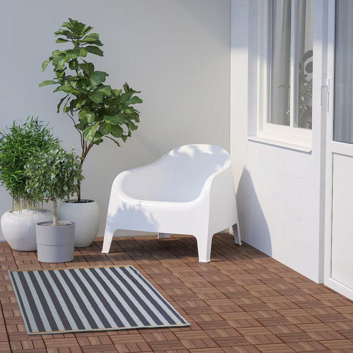 "Colorful IKEA flatwoven rug in a cozy bedroom-50551971