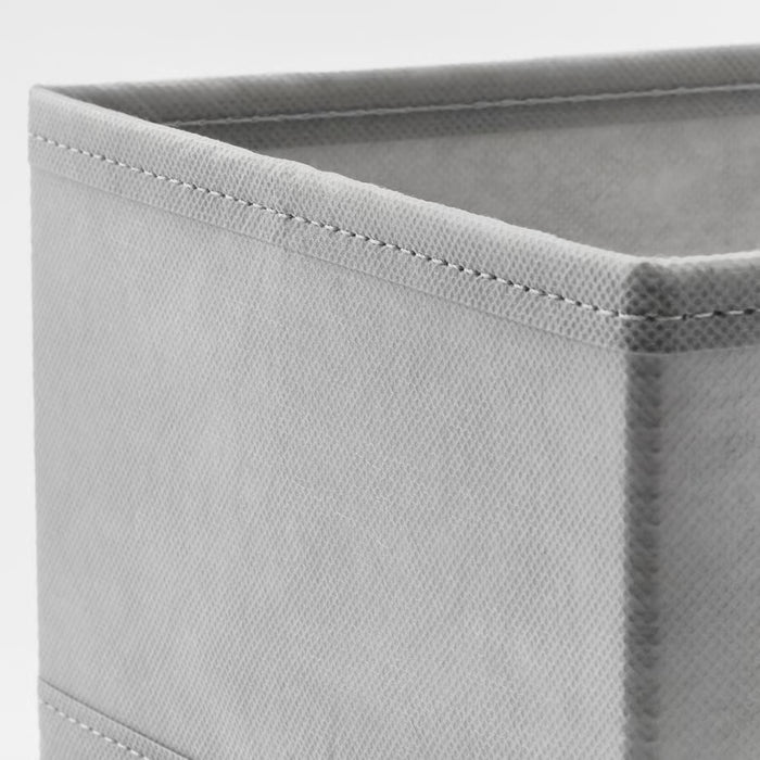 Close-up of IKEA KOSINGEN light grey box showing recycled polyester fabric texture and soft finish