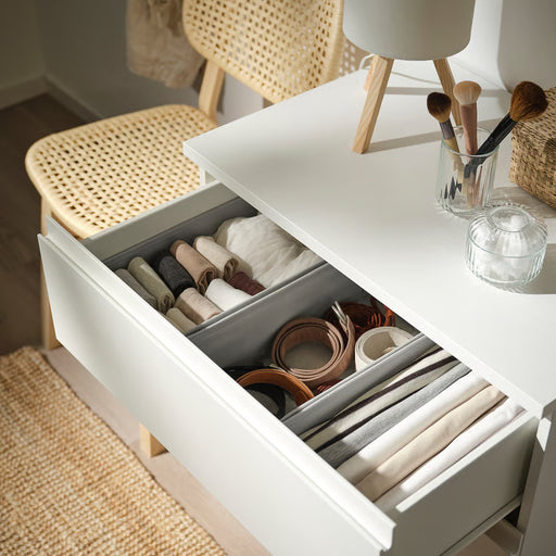 IKEA KOSINGEN light grey box placed inside open chest of drawers organising socks and innerwear