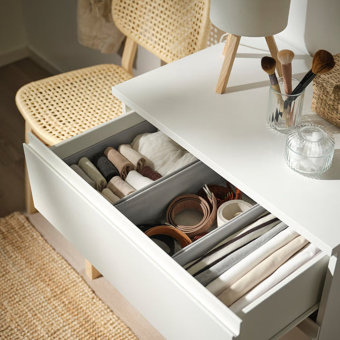 IKEA KOSINGEN light grey box placed inside open chest of drawers organising socks and innerwear