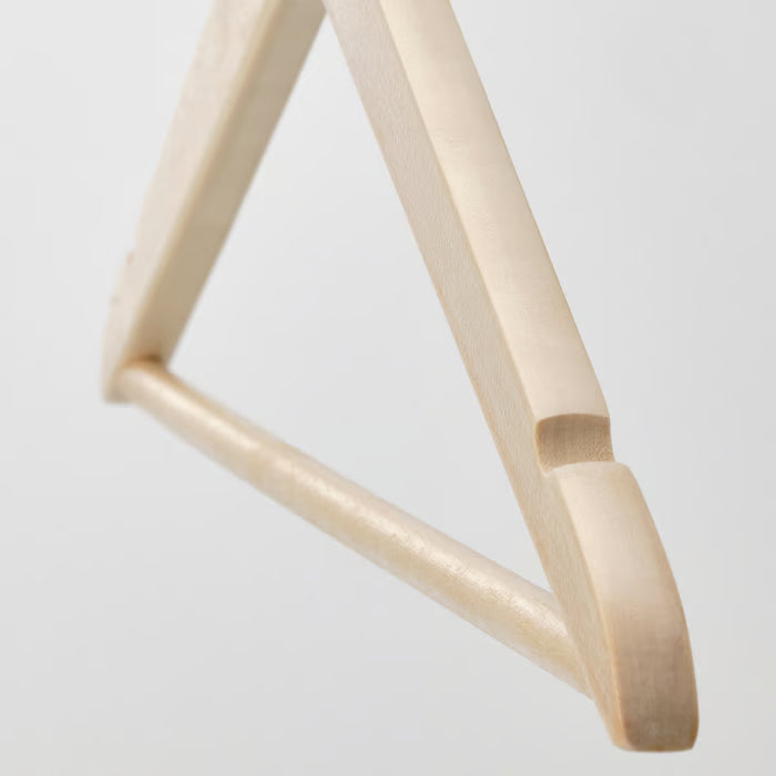 Close-up of IKEA KRÄNGA wooden hanger showing smooth curves natural wood finish and sturdy steel hook